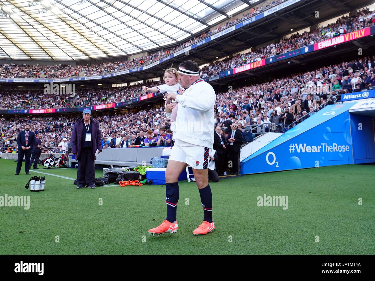England's Jamie George walks out with his daughter, Lydia, ahead of the ...