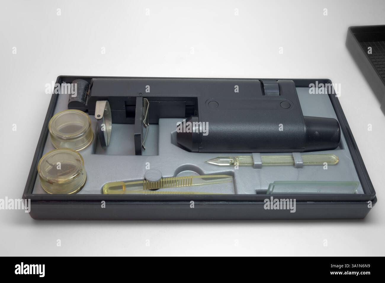 educational microscope in portable case for storing with tools and asseseories. with clipping path Stock Photo