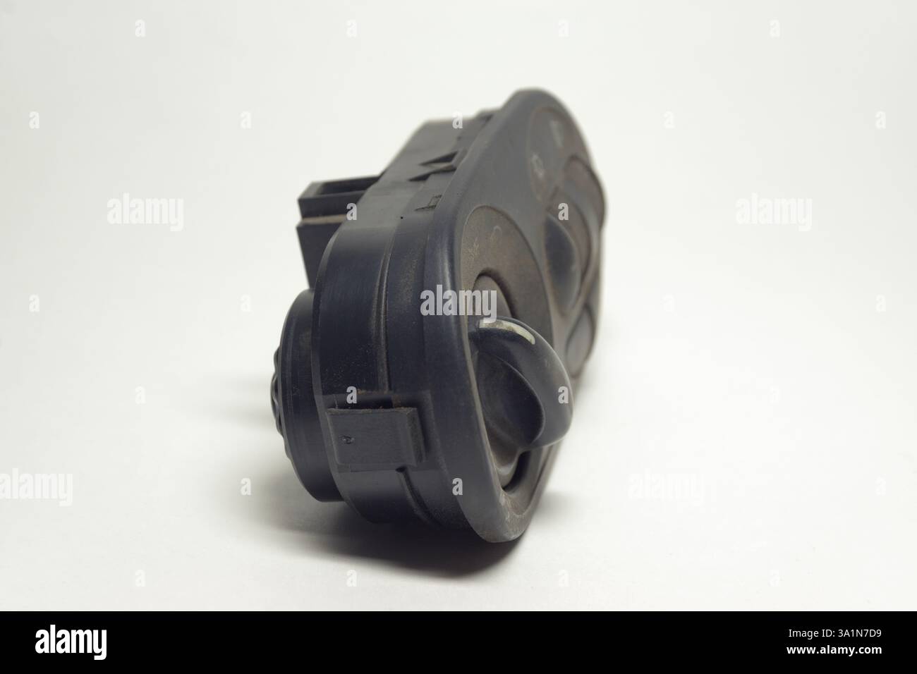 headlight main switch control on white background, closeup Stock Photo