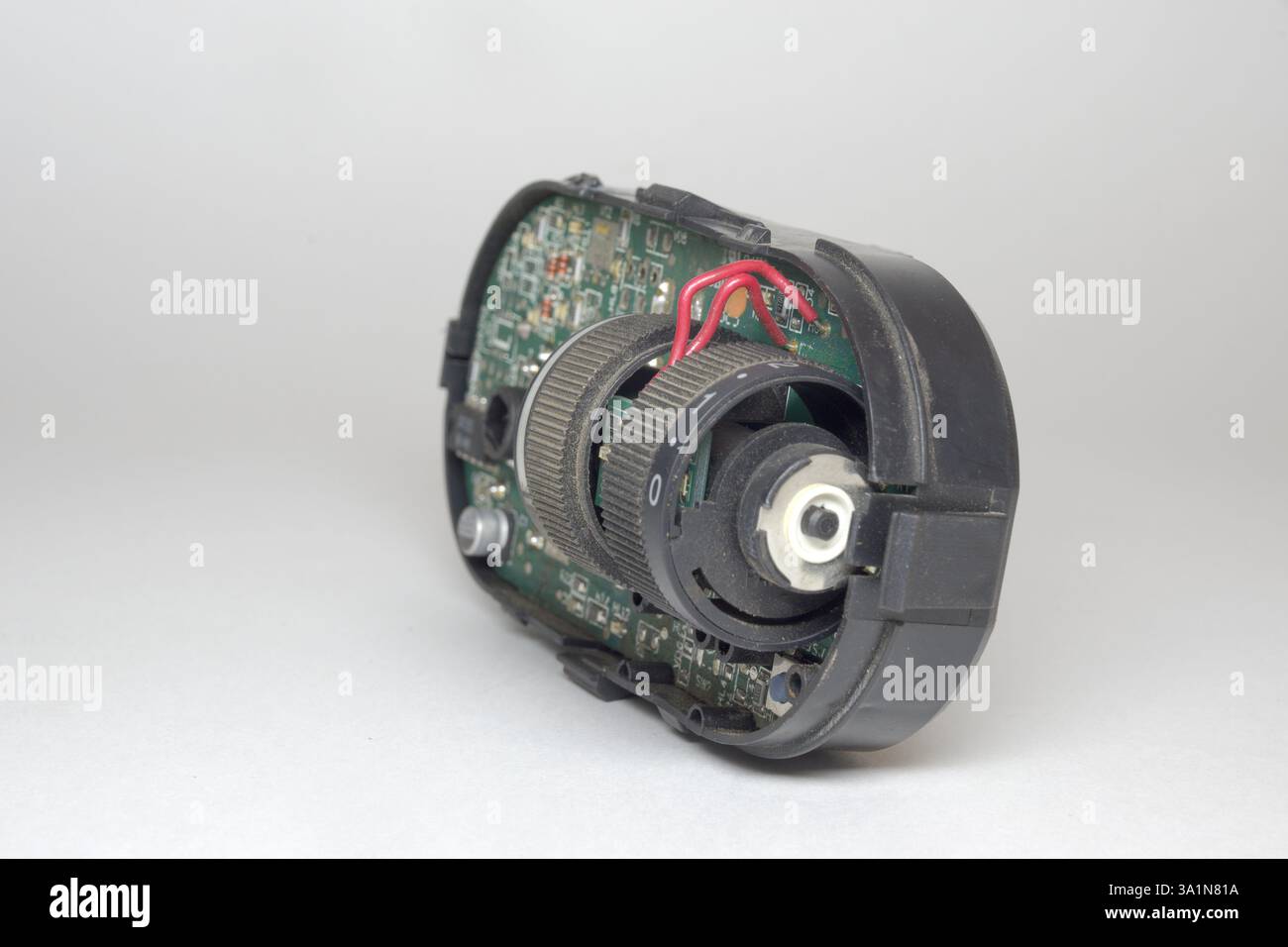 car headlight position control module inner electronic parts, leveler and brightness wheel on main board Stock Photo