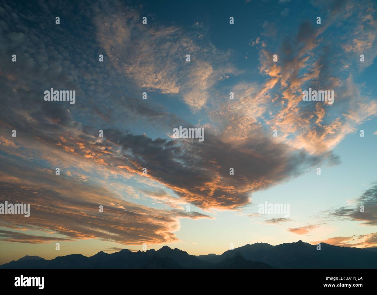 Dramatic sunset or sunrise time dramatic sky over mountain ranges Stock Photo