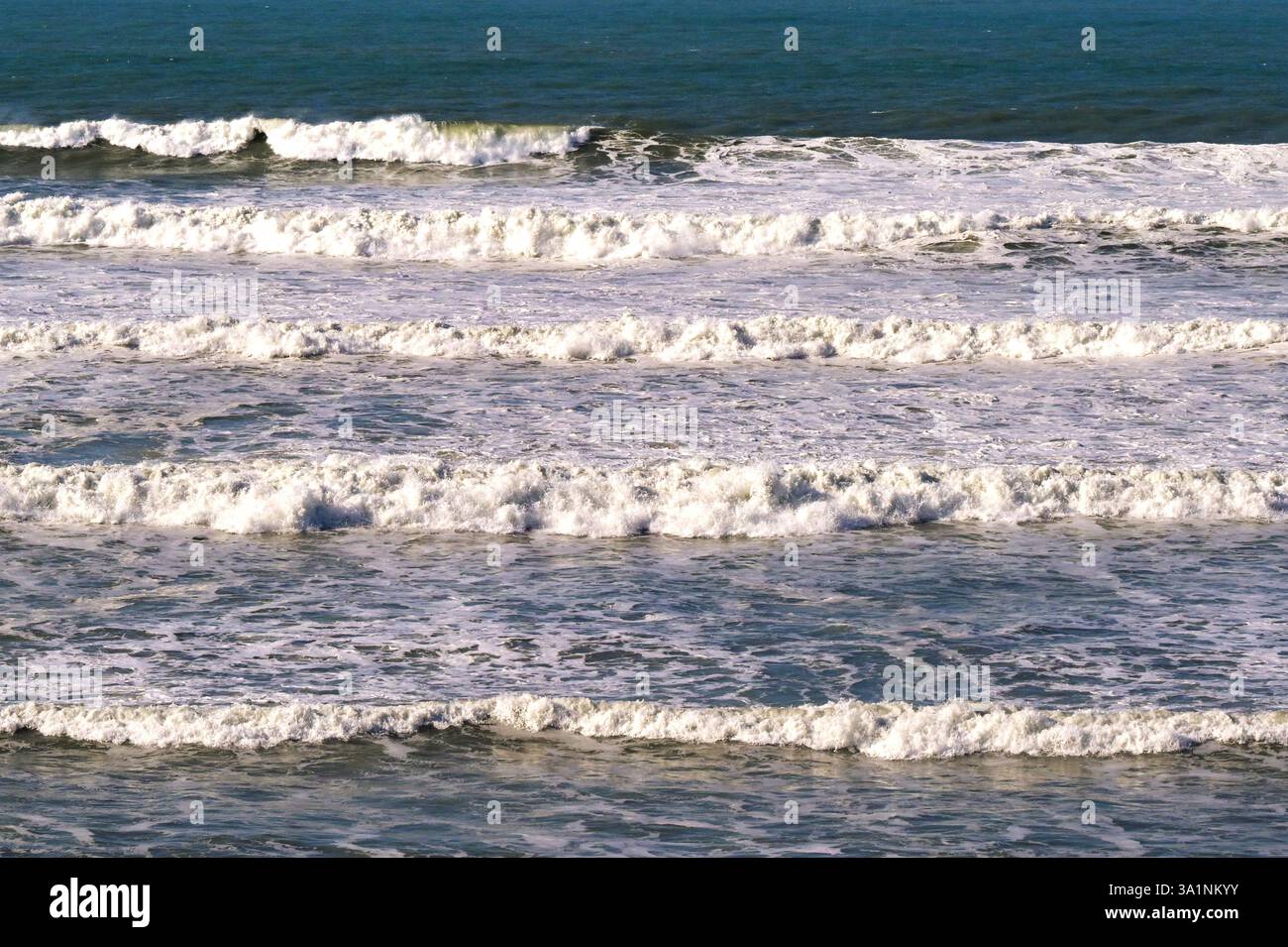 Waves rolling into a beach. No people. Stock Photo