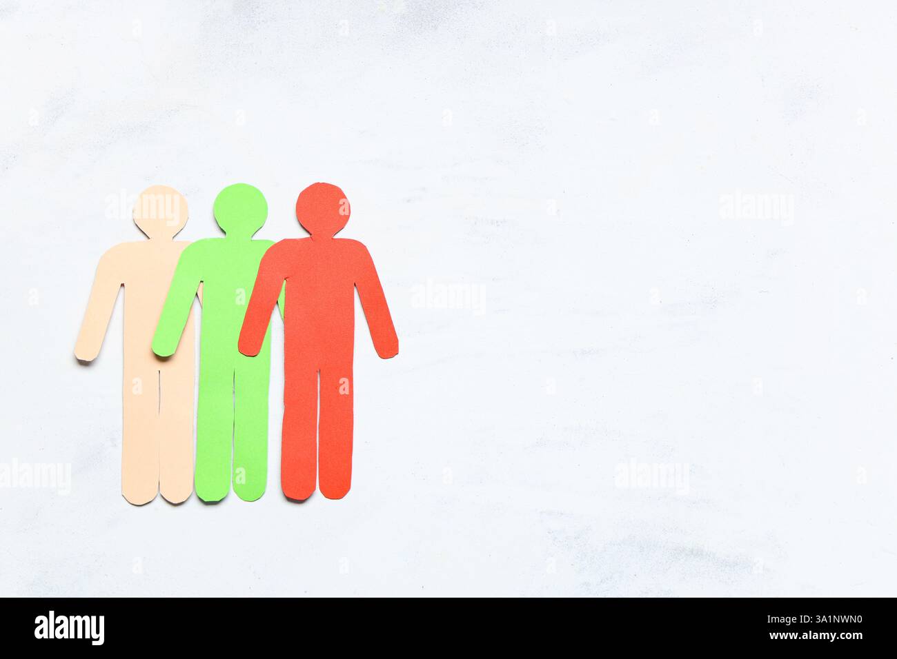 Paper human figures on light background Stock Photo - Alamy