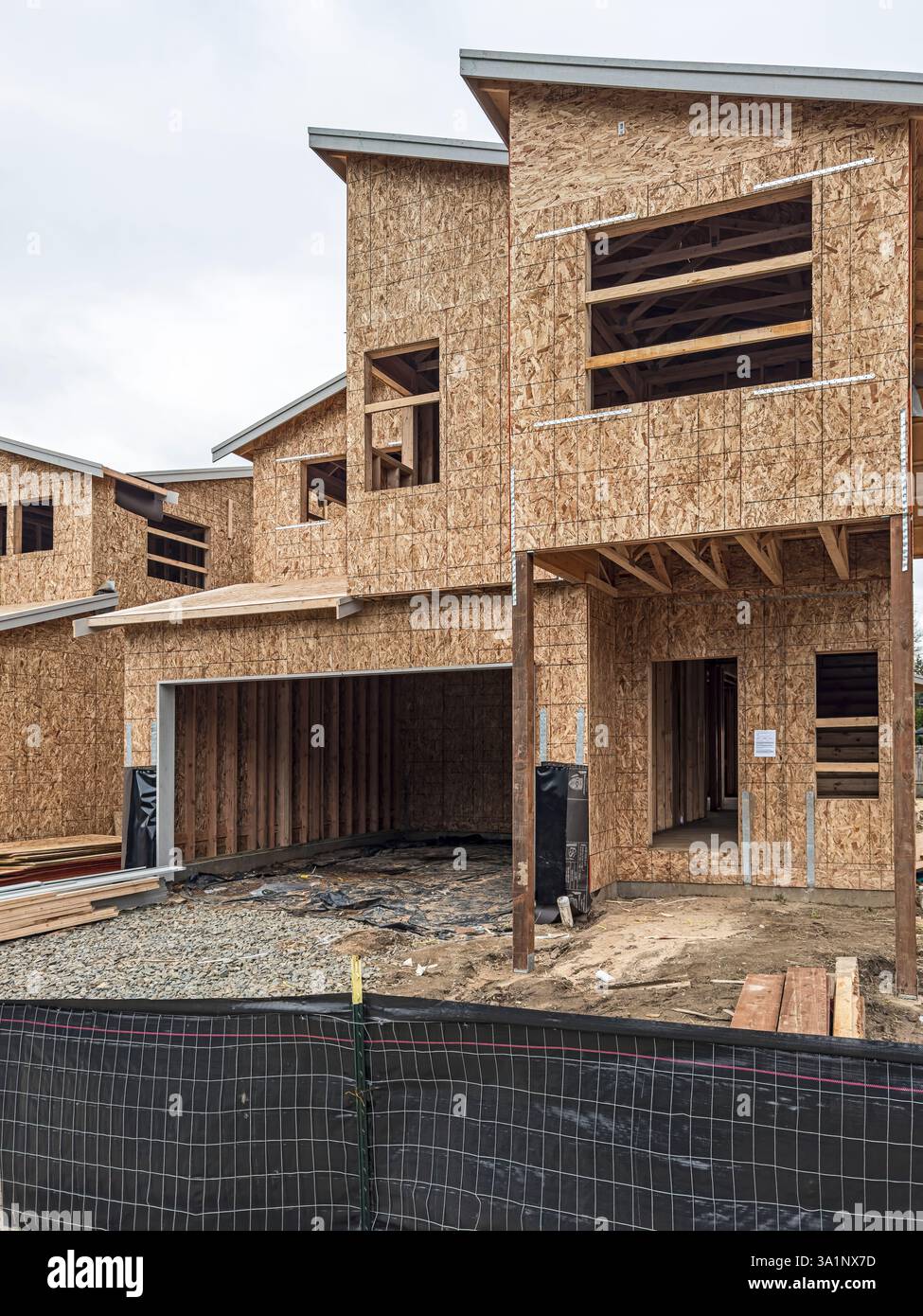Housing construction framing in Olympia, Washington, USA, on 3/8/25.  This construction uses Oriented Strand Board (OSB). - Smartphone Captured Stock Image