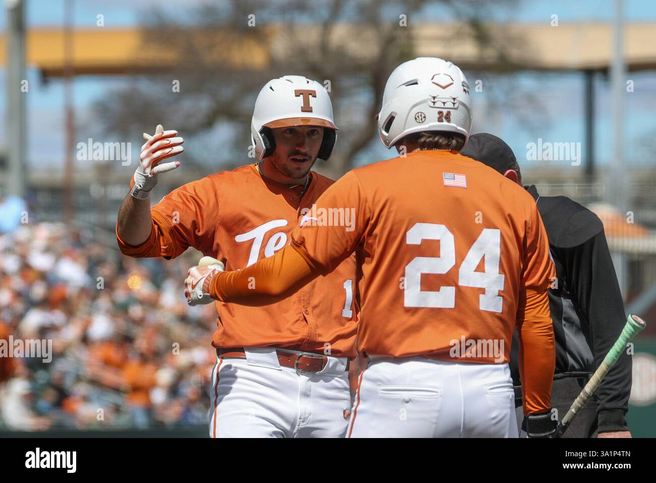 AUSTIN, TX - MARCH 09: Texas infielder Jalin Flores (1) is greeted at ...