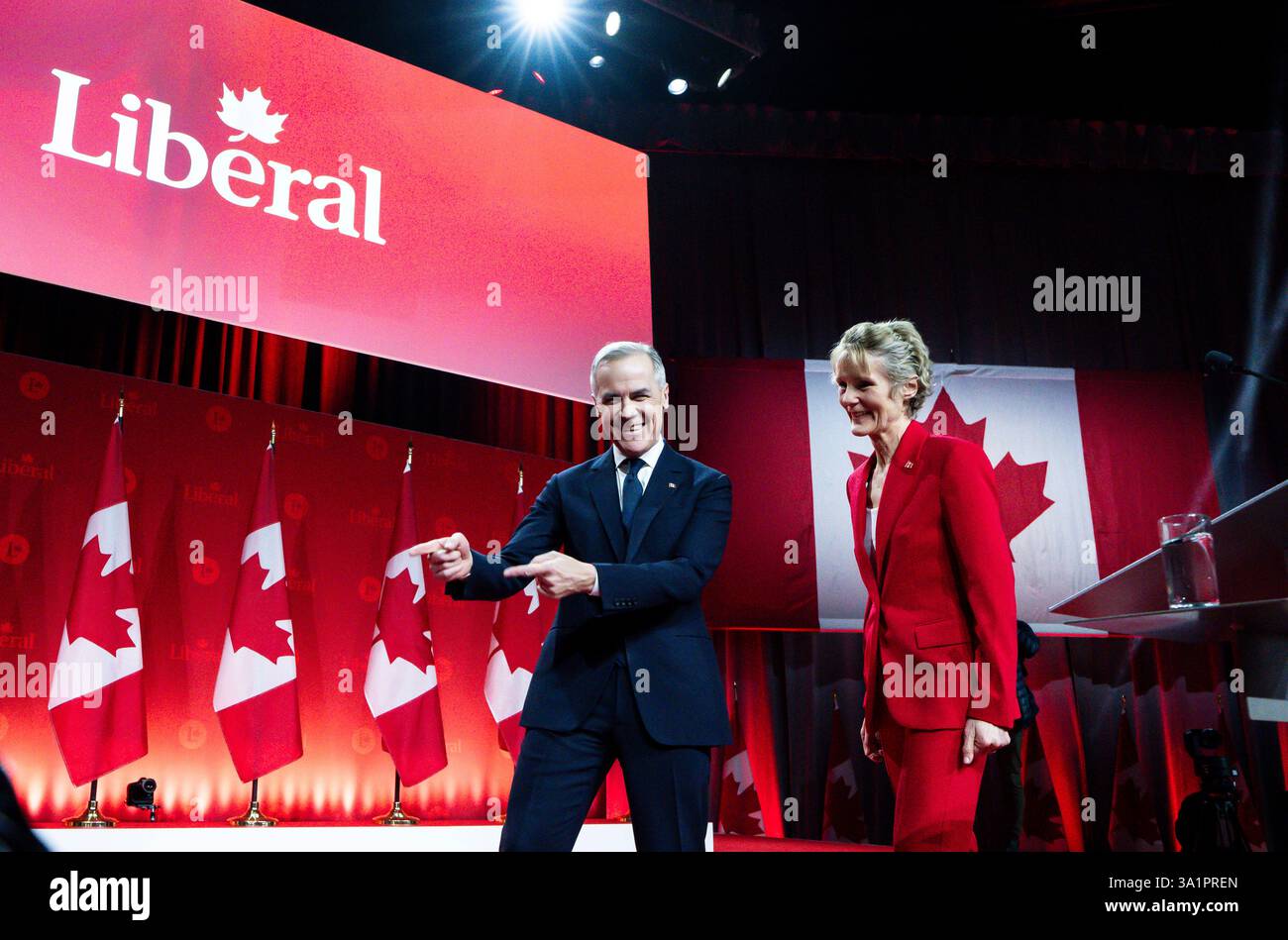 Mark Carney, Leader of the Liberal Party of Canada, walks with his wife