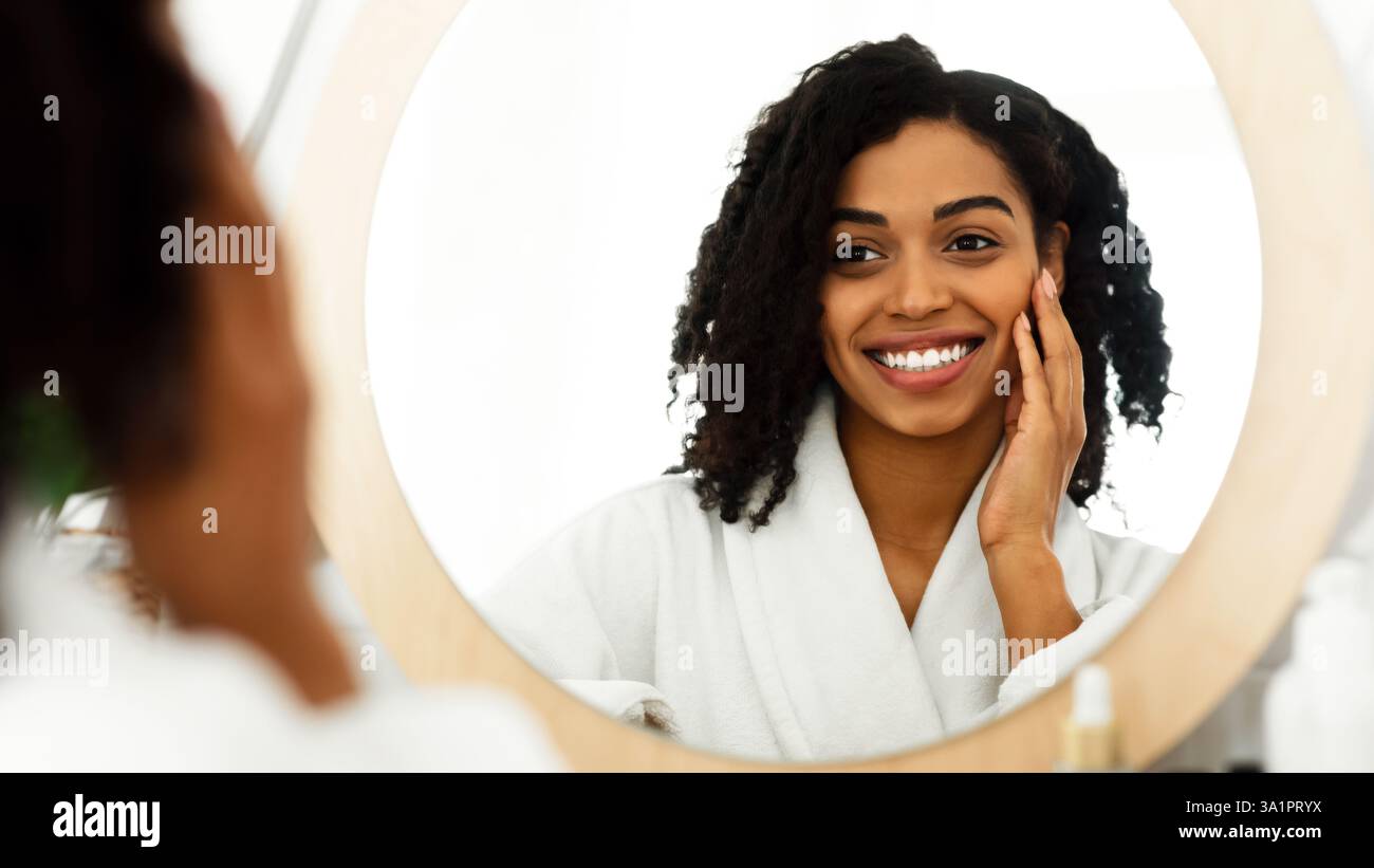 Happy Black Woman Touching Her Beautiful Face While Looking In The ...
