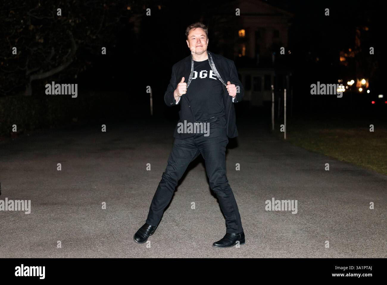 Washington DC, USA. 09th Mar, 2025. WASHINGTON – March 9, 2025: Elon Musk  reveals a DOGE t-shirt and a Tesla belt buckle before entering the White  House. Joshua Sukoff/Medill News Service Credit: