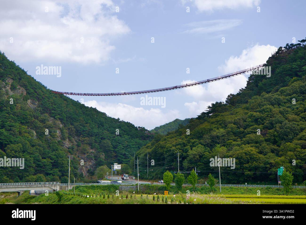 Sunchang County, South Korea - October 4, 2021: The Chaegye-san Suspension Bridge stretches across a deep mountain valley, connecting the peaks of Cha Stock Photo