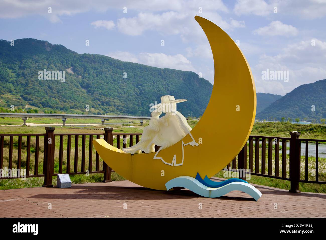 Sunchang County, South Korea - October 4, 2021: A modern sculpture featuring a crescent moon and a translucent figure of a traditionally dressed Korea Stock Photo