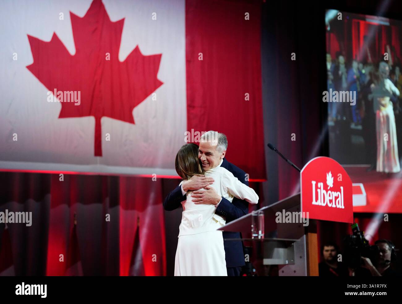 Liberal Party of Canada Leader Mark Carney embraces his daughter Cleo