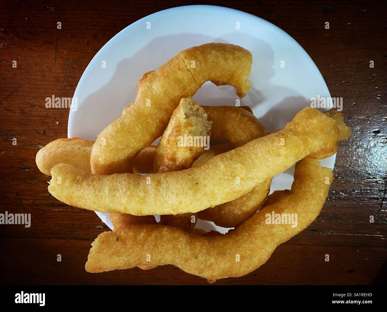 Churros called 'porras' for sale in a bar in Ronda, Malaga, Andalusia, Spain - Smartphone Captured Stock Image