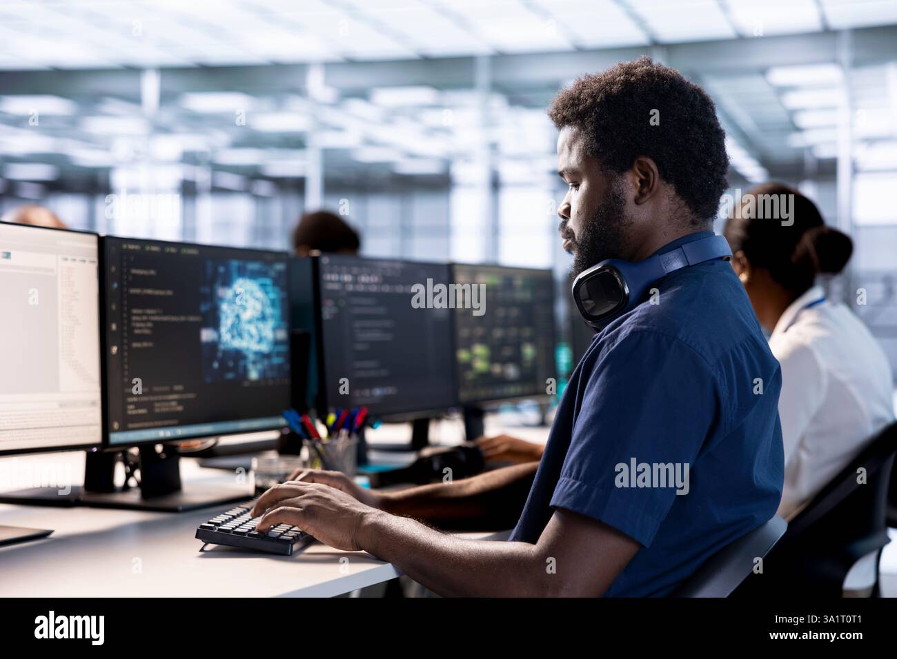 Artificial intelligence engineer in data center checks for performance issues arising due to high CPU usage. Machine learning expert in server farm fixing insufficient memory errors slowing hardware Stock Photo