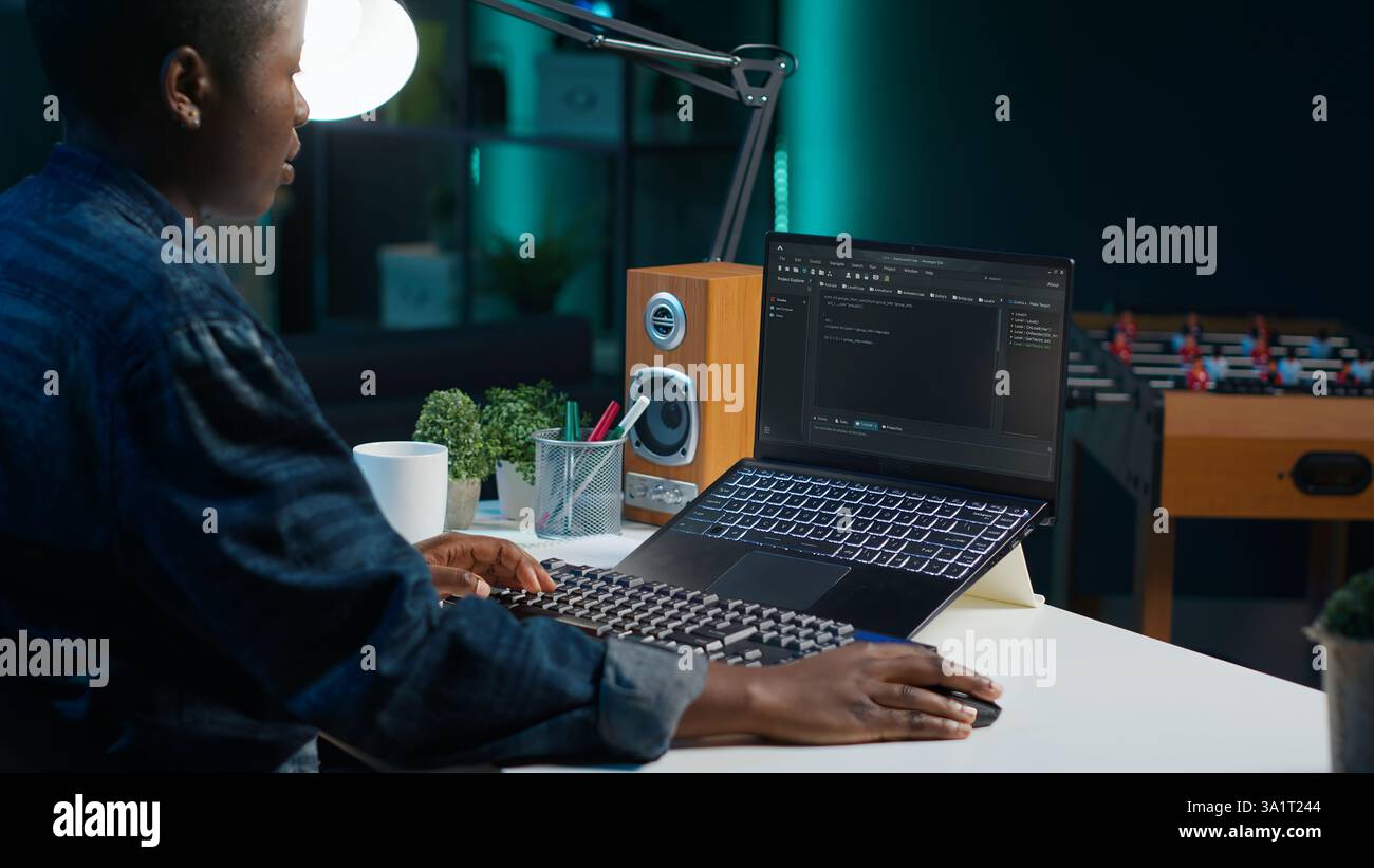 Freelancing admin in home office using laptop to write programming language code. Software technician working from home using notebook device to build application, camera A Stock Photo