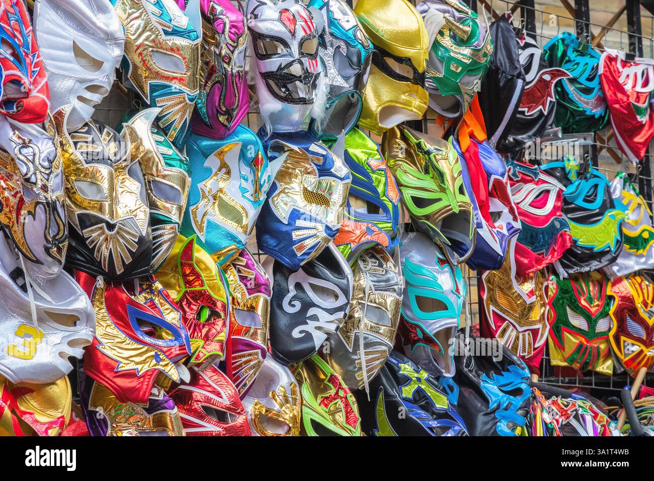 A selection of wrestling masks displayed at a street stall of Brick Lane Market in London, uk Stock Photo