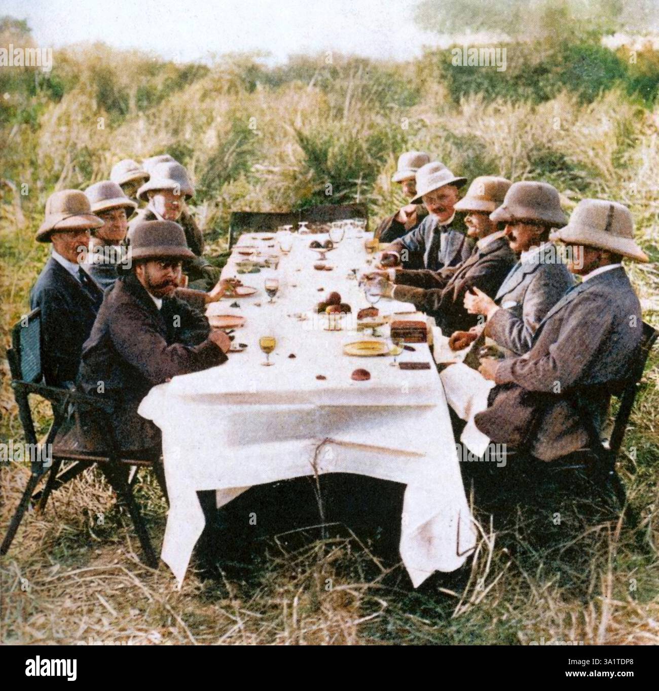 King George V (1865-1936) having lunch after hunting tigers in Nepal, 1911 (1936). The King and Queen Mary travelled to India in 1911 to attend the Delhi Durbar, held to commemorate their coronation. George, the second son of Edward VII and Alexandra of Denmark, was born at Marlborough House on 3rd June, 1865. In 1893 he married Princess Mary (with whom he had six children) and in 1910, upon the death of his father, he became king. In 1924 he appointed Ramsay MacDonald, Britain's first Labour Prime Minister, and in 1932 he introduced the idea of broadcasting a Christmas message to the people. Stock Photo