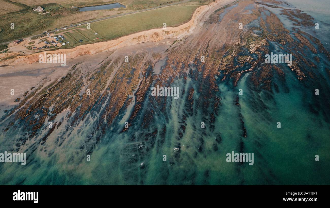 Very low tide at Compton beach on an August summers day Stock Photo Alamy