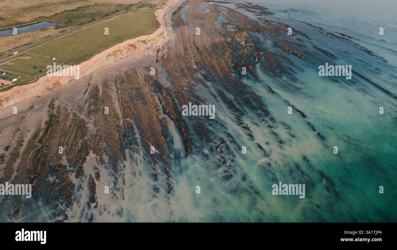 Very low tide at Compton beach on an August summers day Stock Photo Alamy
