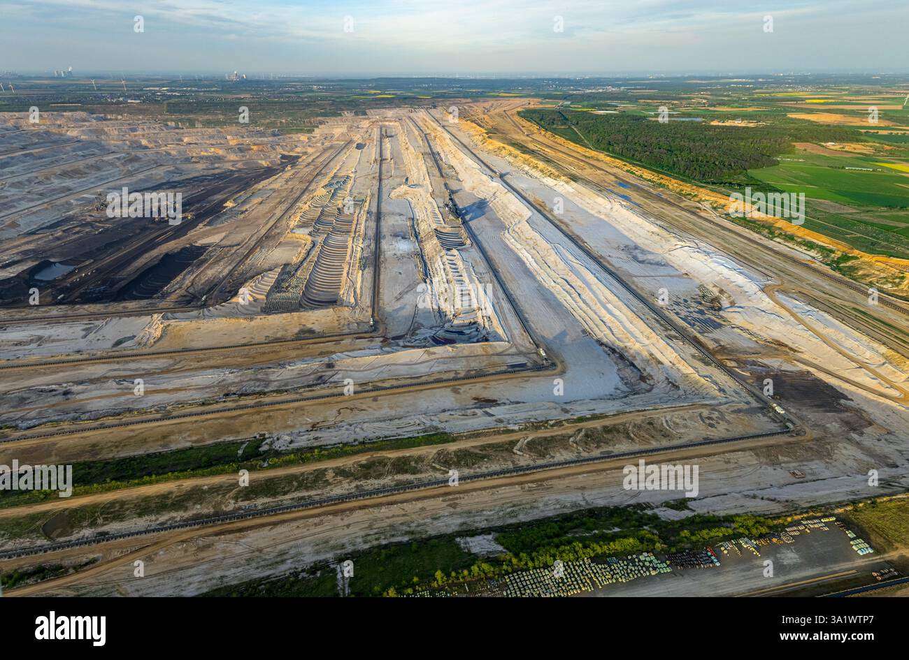 Aerial view, opencast lignite mine Hambach Forest, lignite mining Rhenish mining area, nature overexploitation, bucket wheel excavator, distant view, Stock Photo