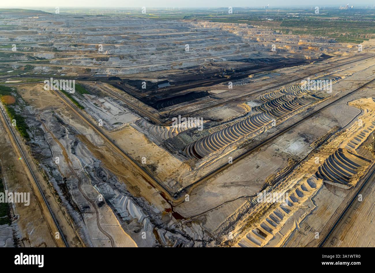Aerial view, opencast lignite mine Hambach Forest, lignite mining Rhenish mining area, nature overexploitation, bucket wheel excavator, distant view, Stock Photo