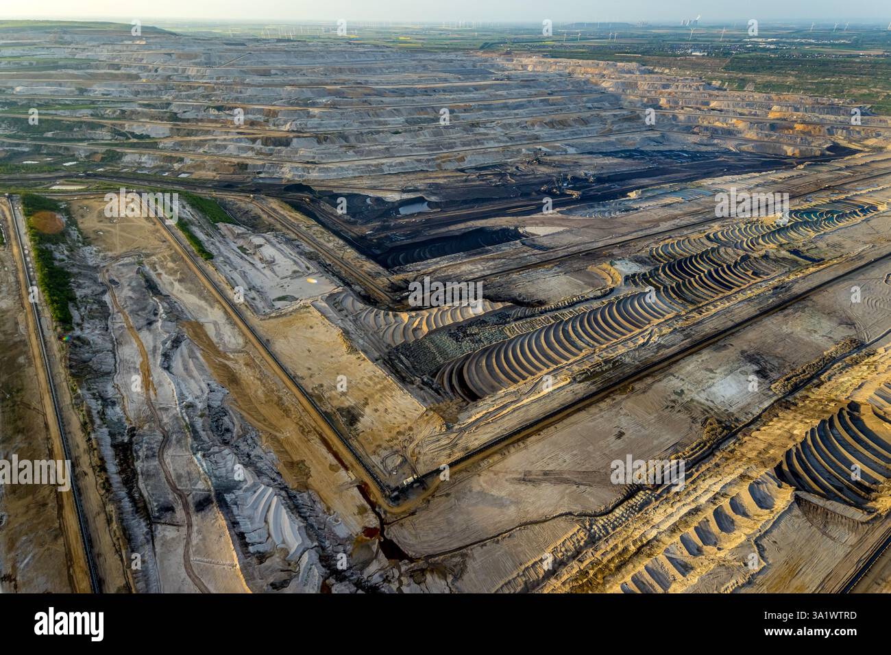 Aerial view, opencast lignite mine Hambach Forest, lignite mining Rhenish mining area, nature overexploitation, bucket wheel excavator, distant view, Stock Photo