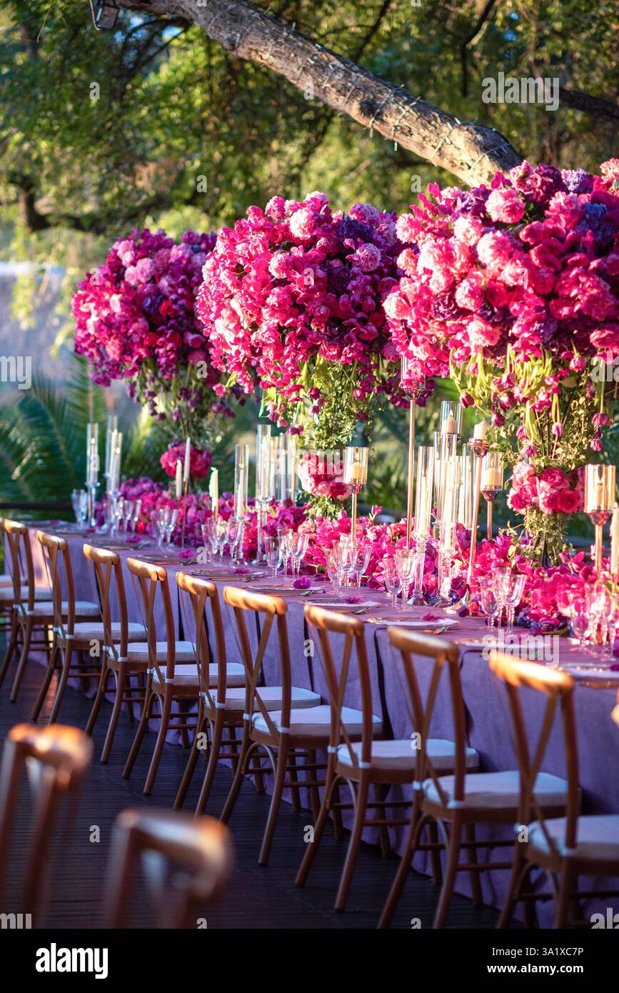 Luxurious Outdoor Wedding Reception with Stunning Floral Arrangements Stock Photo