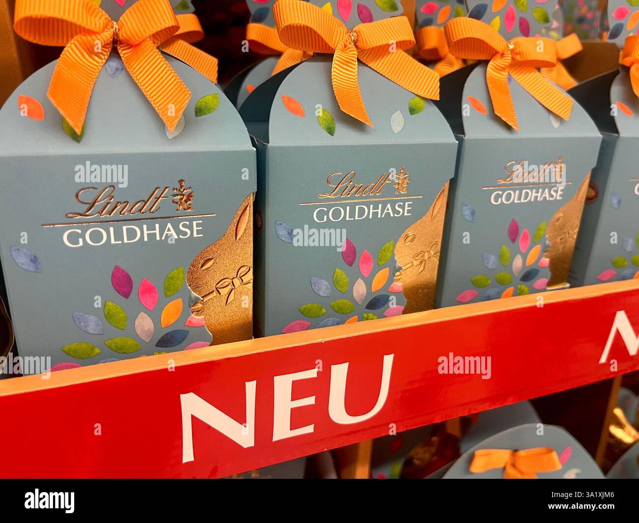 new, Lindt, Easter, Gold Bunny, chocolates, Easter treats, Easter chocolates, packaging, gold bunny Easter eggs, Easter egg, traditional sweets, 2025 - Smartphone Captured Stock Image
