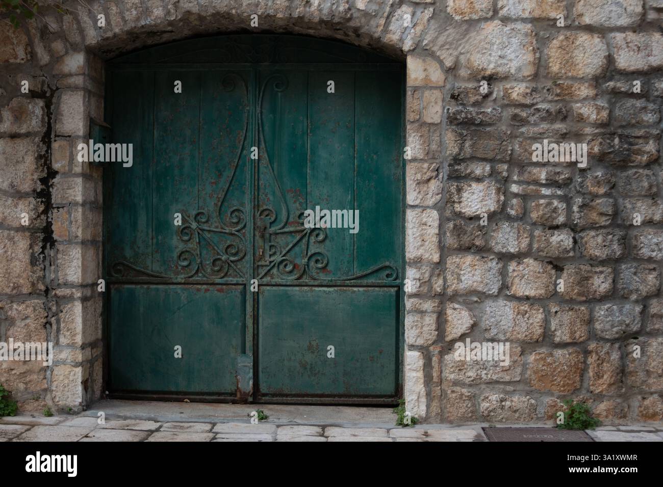 Antique decorated wooden door in an old stone house in Hvar Stock Photo ...
