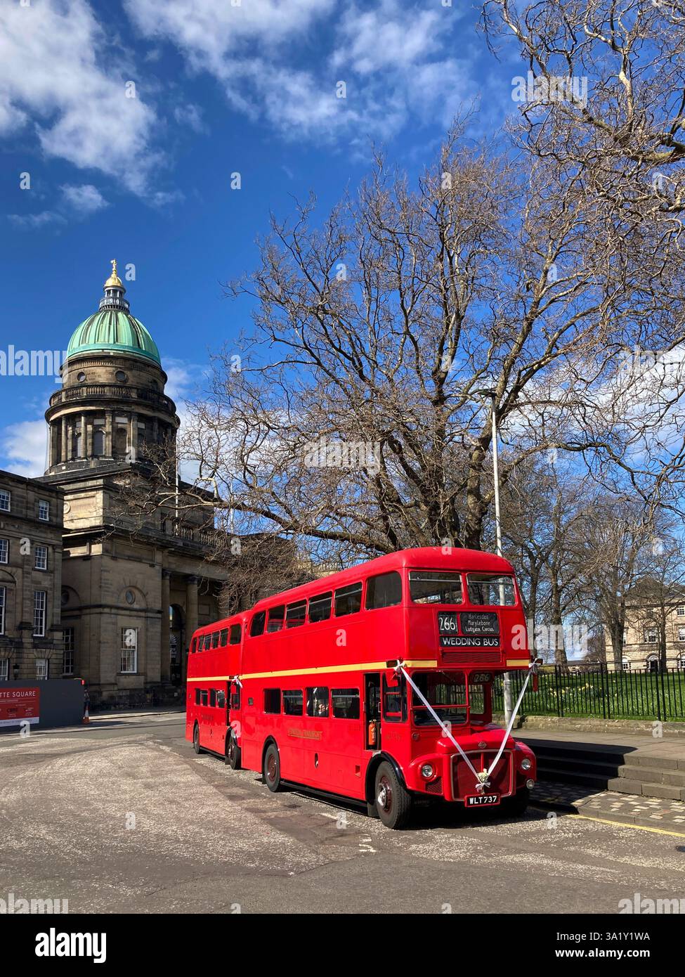 Iconic routemaster double-decker red bus, repurposed for Wedding party, parked up in Charlotte Square, Edinburgh, Scotland - Smartphone Captured Stock Image