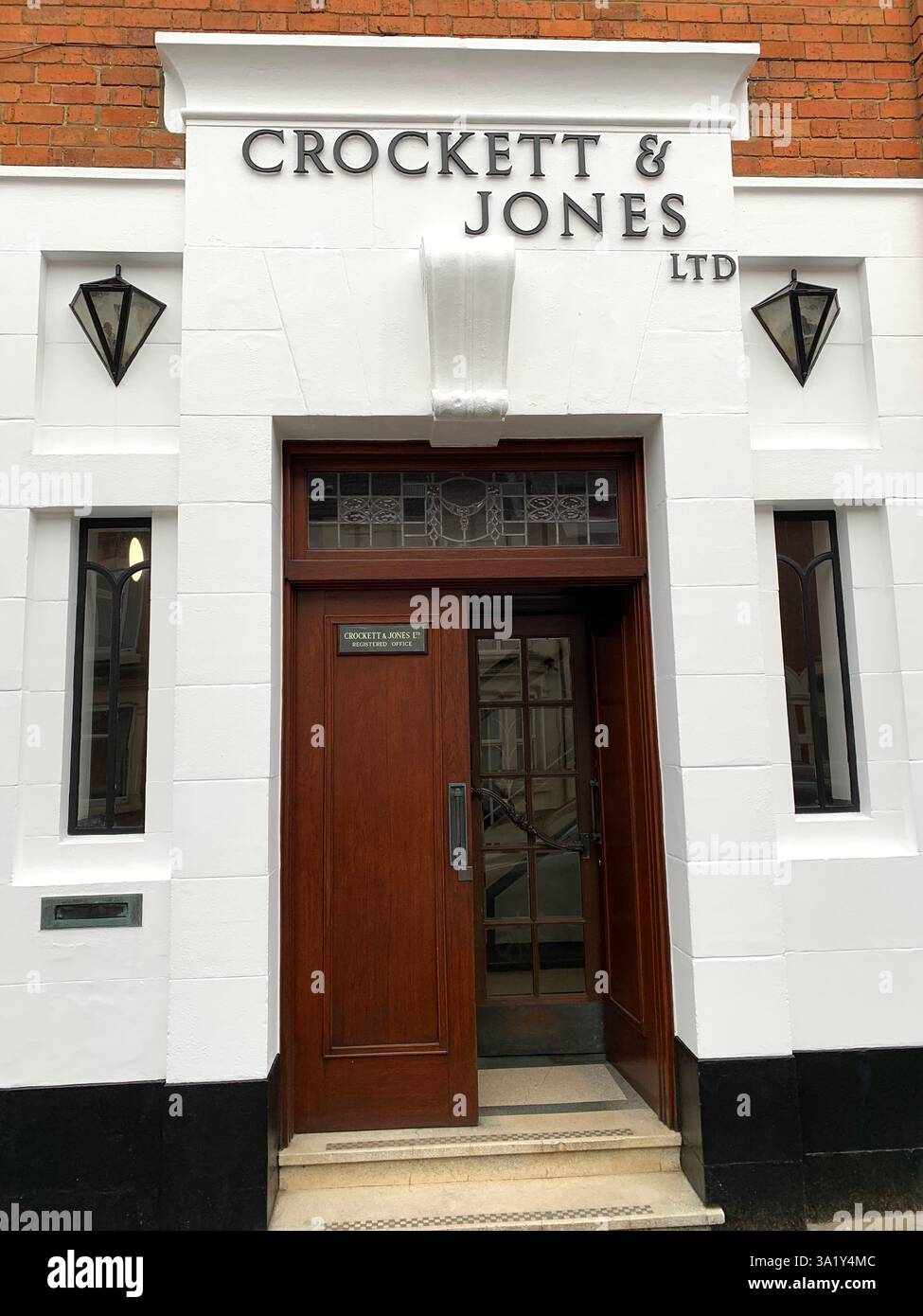 Crockett and Jones Boot and shoe Northampton hoes boots men Mens ladies lady leather works factory building entrance store repair make makers - Smartphone Captured Stock Image