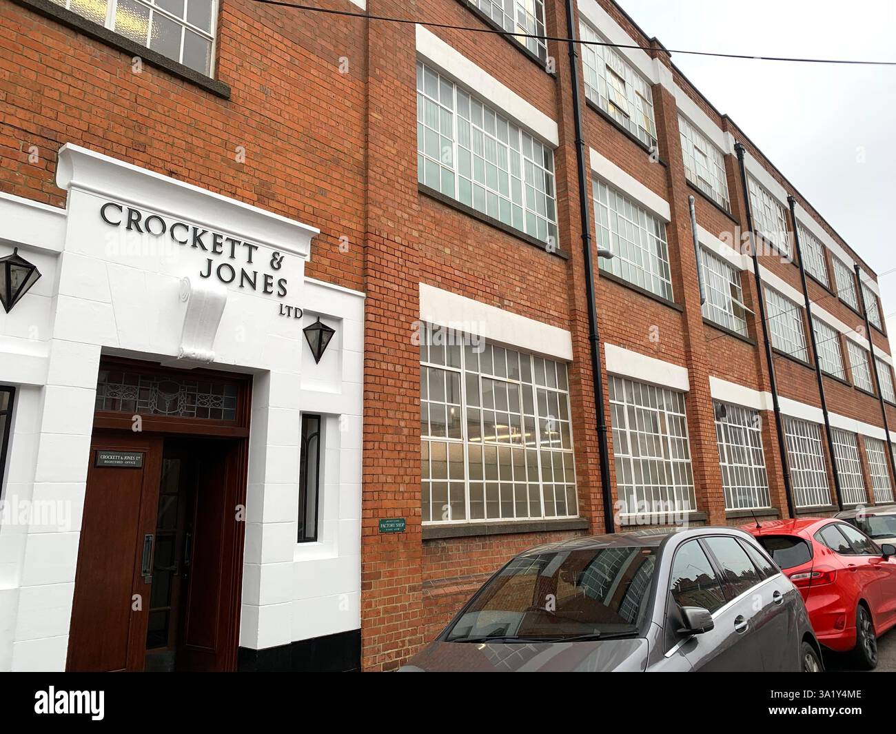 Crockett and Jones Boot and shoe Northampton hoes boots men Mens ladies lady leather works factory building entrance store repair make makers - Smartphone Captured Stock Image