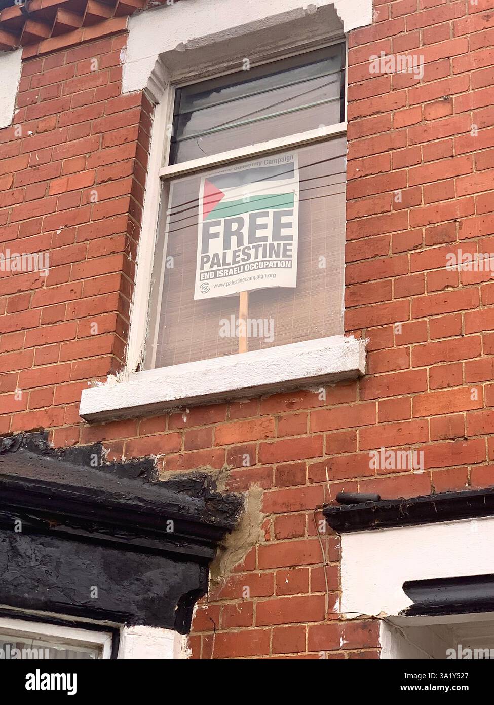 Free Palestine window sticker post sign signs help flag wall people lives live home small paper support supporters style type show flags local places - Smartphone Captured Stock Image