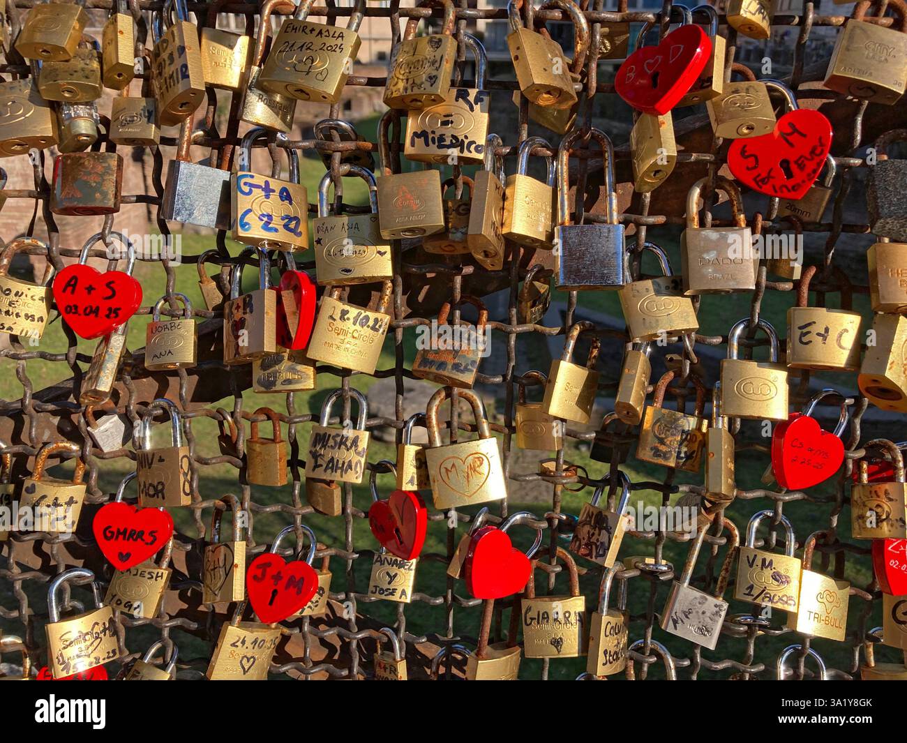Italy, Lazio, Rome, Piazza Colosseo Square,  Padlock with Heart Shape attached to Fence Ruins of Ludus Magnus - Smartphone Captured Stock Image