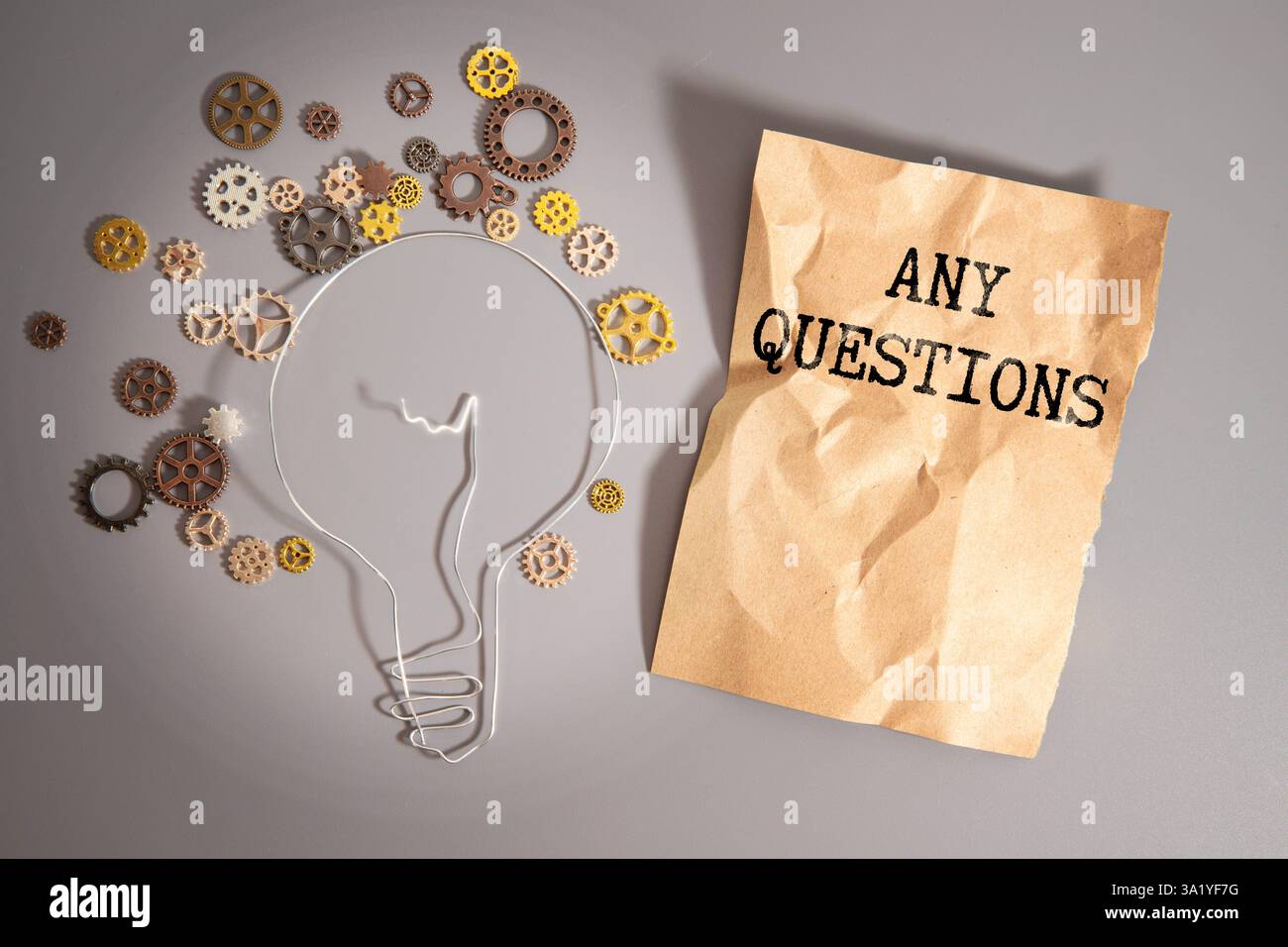 Notepad with text Any Question. on yellow background. Stock Photo