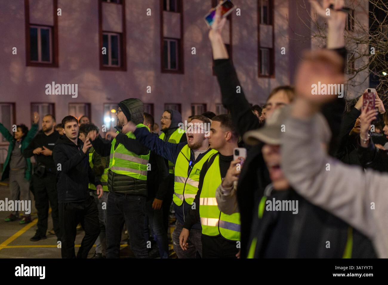 Students blocking the public broadcaster RTS building shout at police ...