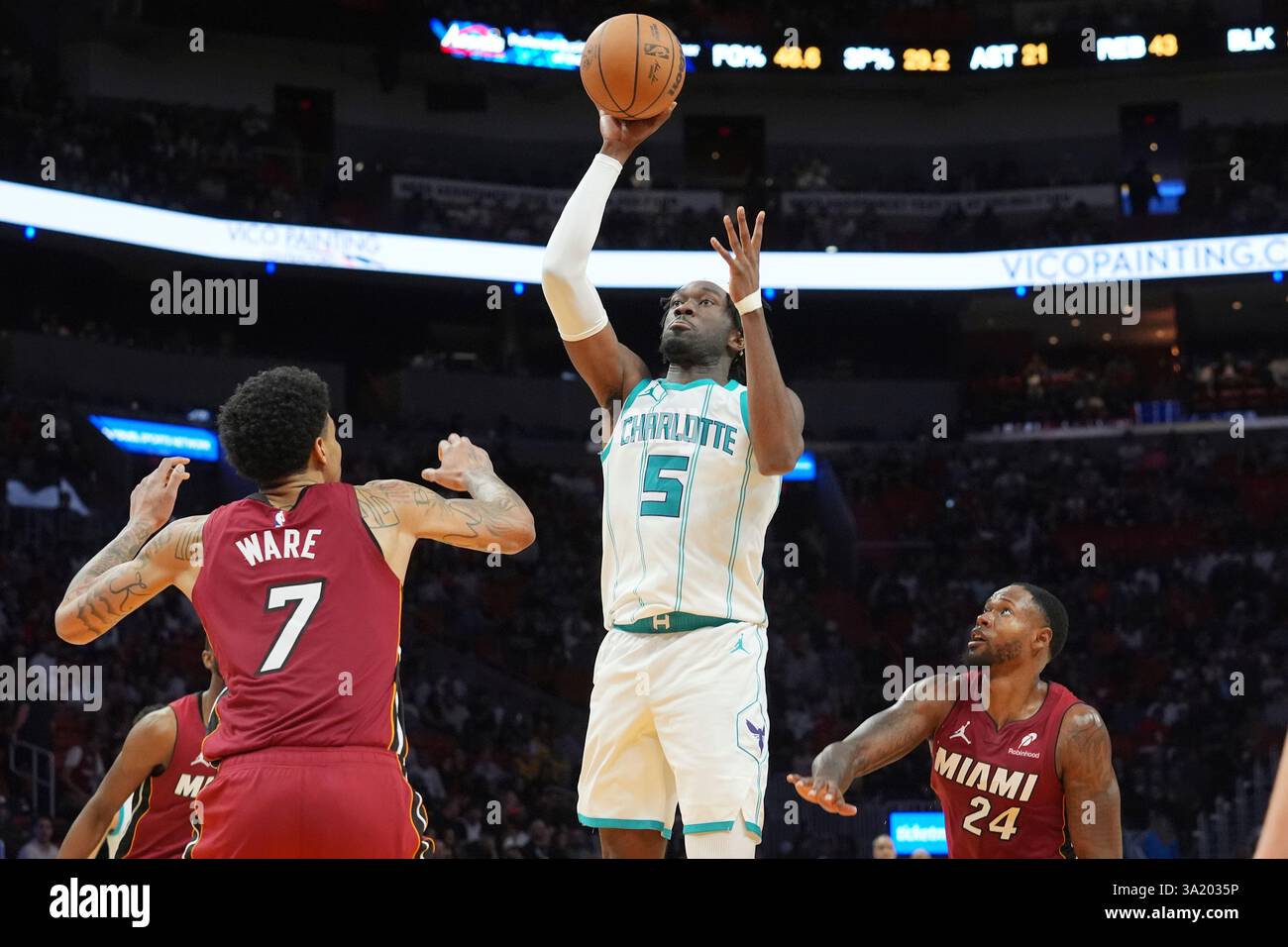 Charlotte center Mark Williams (5) aims a threepoint basket during the second half of
