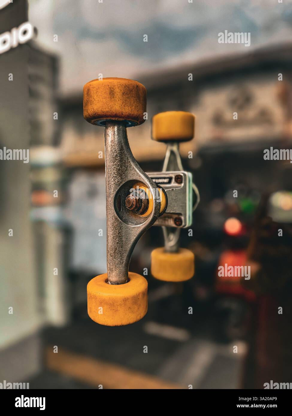 Unique door handle made from skateboard wheels 2 A creative door handle designed using a skateboard truck and wheels, mounted on a glass door. The inn - Smartphone Captured Stock Image