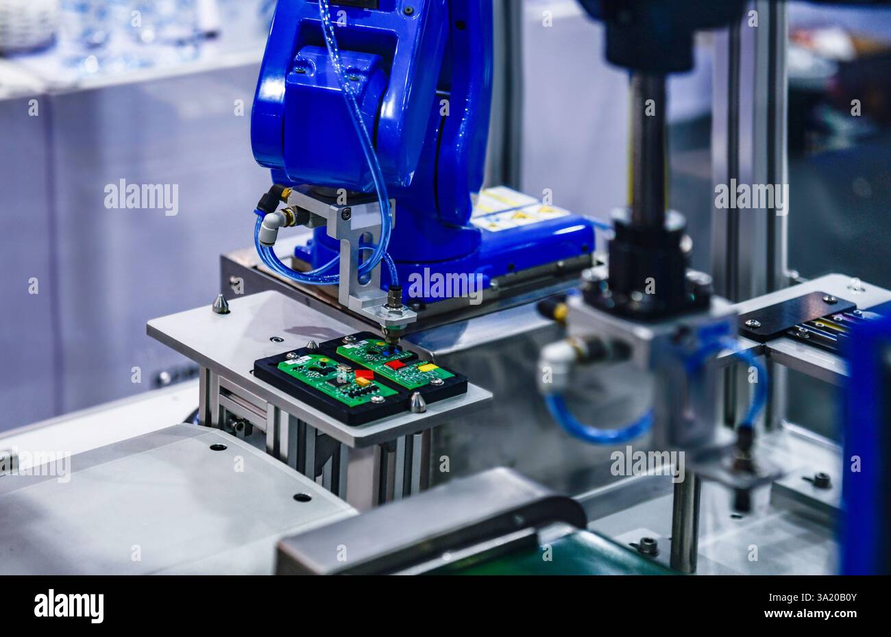 Automatic robots for assembling electronic circuit boards in factories Stock Photo