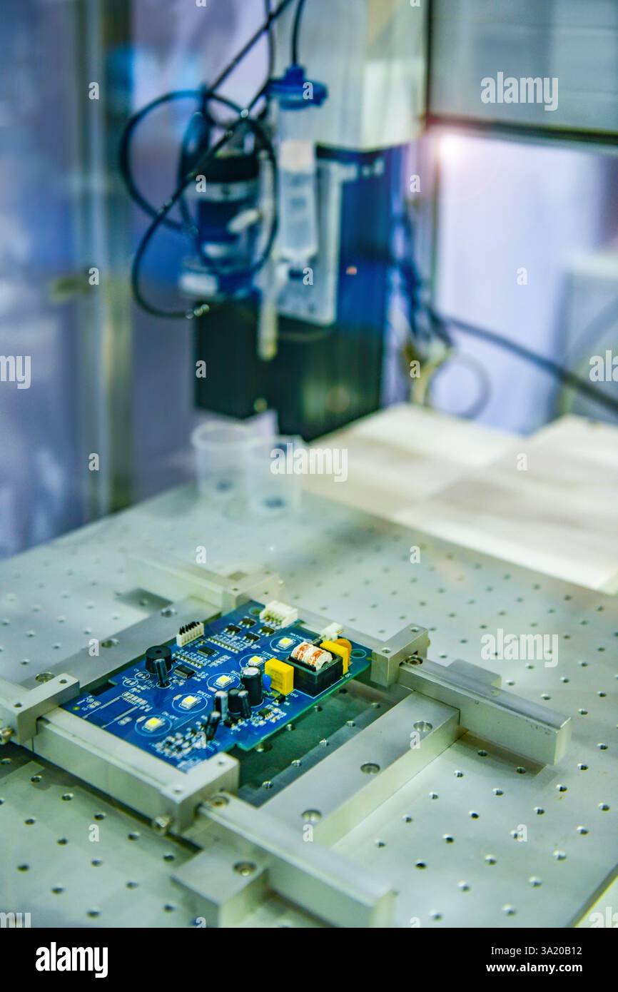 Automatic robots for assembling electronic circuit boards in factories Stock Photo