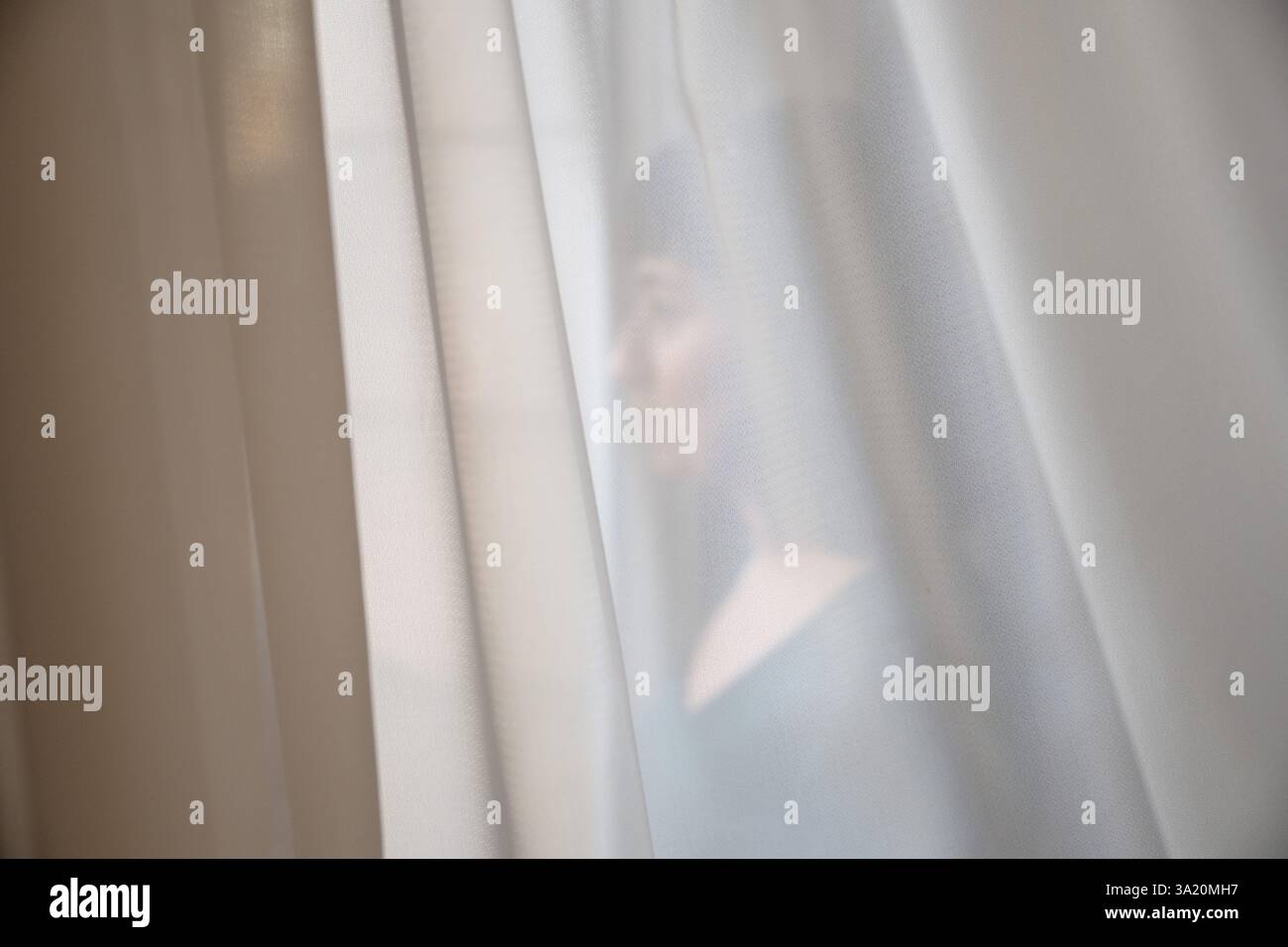 PRODUCTION - 28 February 2025, Iran, Teheran: An interviewee looks out