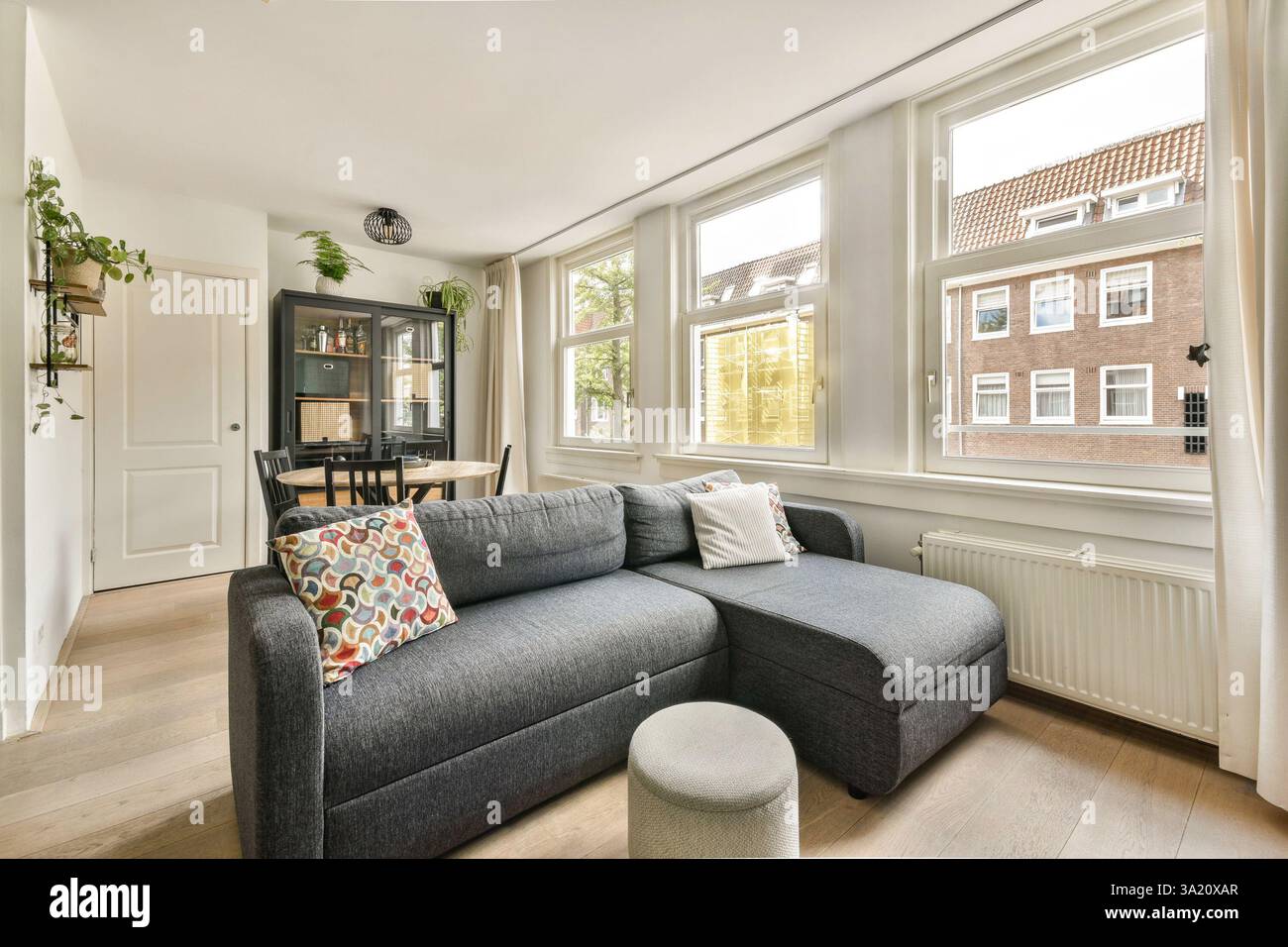A stylish modern living room featuring a comfortable sectional sofa ...