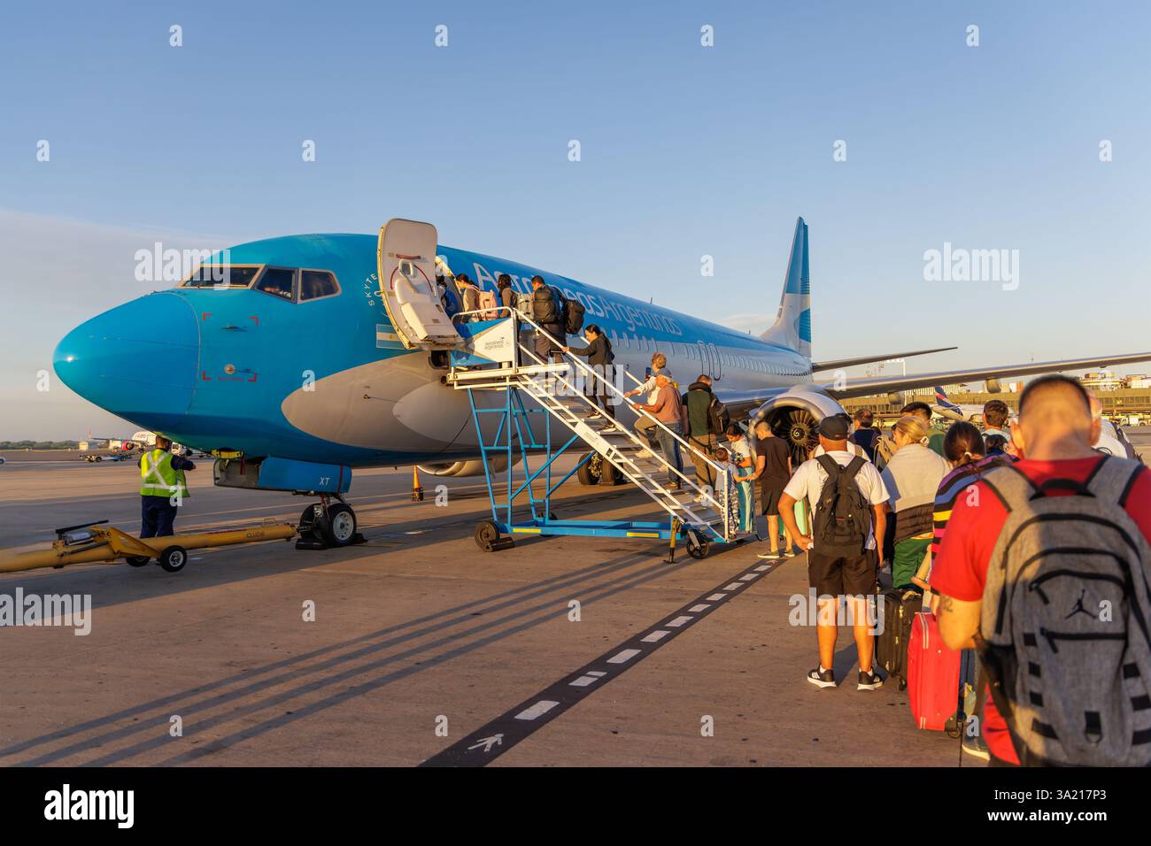 Buenos Aires, Argentina - January 10th, 2025: Tourists boarding a plane at Ezeiza International Airport in Buenos Aires. Stock Photo