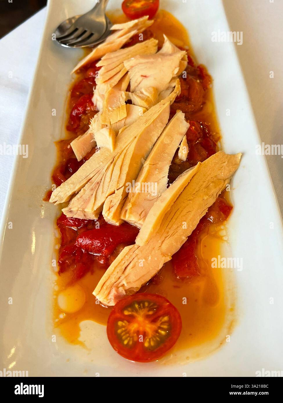 Tuna loin with red peppers salad. Spain. - Smartphone Captured Stock Image