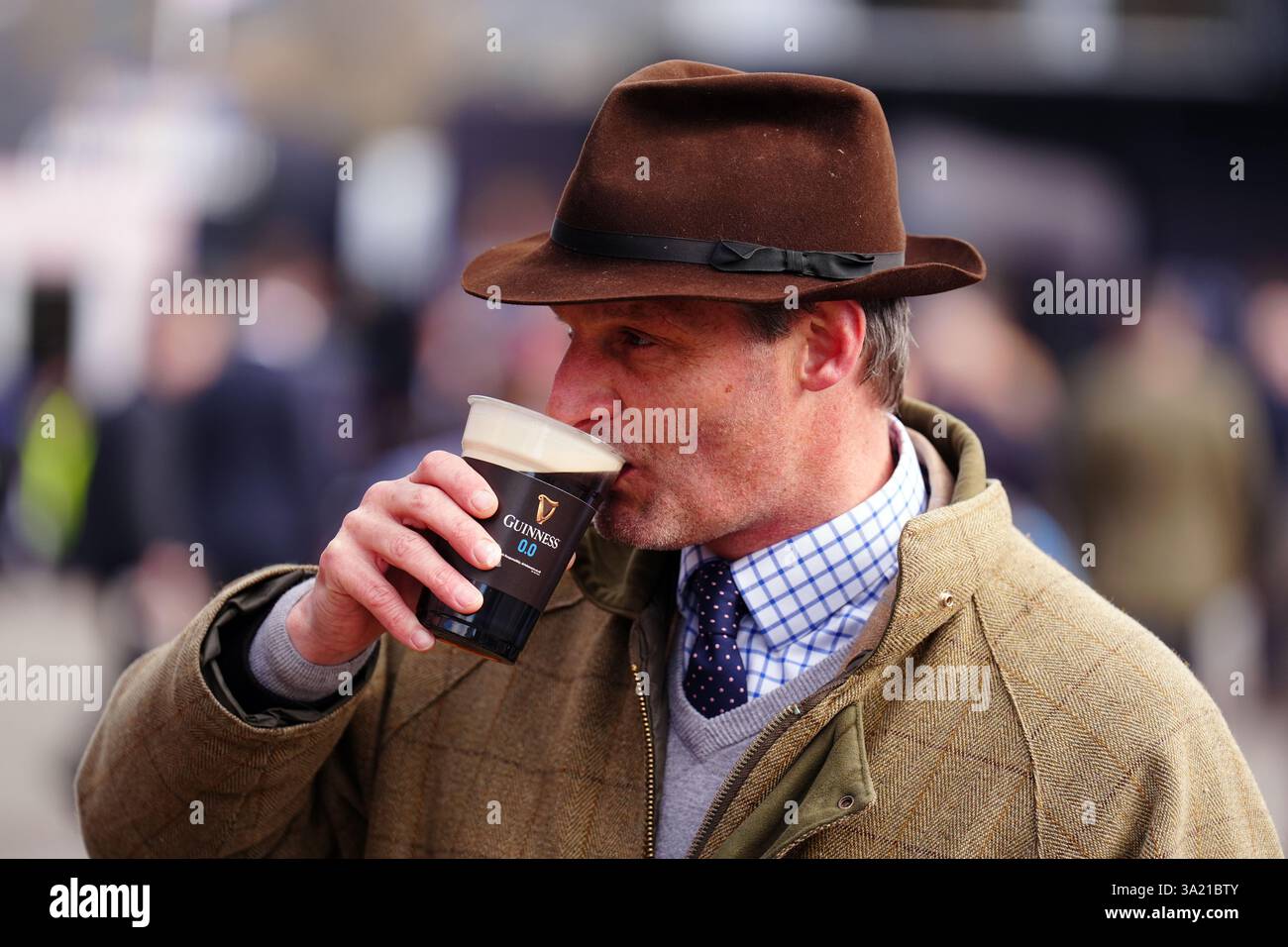 A racegoer with a pint of Guinness on day one of the 2025 Cheltenham ...
