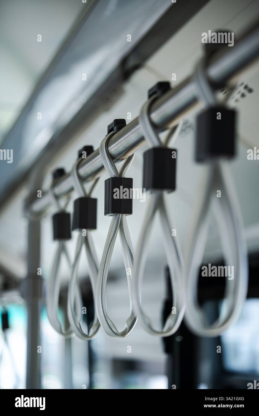 Hand Some Handle Close up shot of hand handles on public transport Stock Photo - Alamy