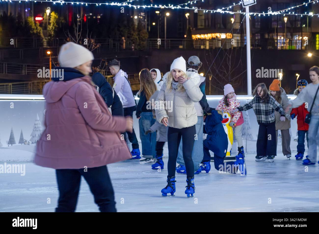 KYIV, UKRAINE - JANUARY 26, 2025: People of different ages enjoy an ...