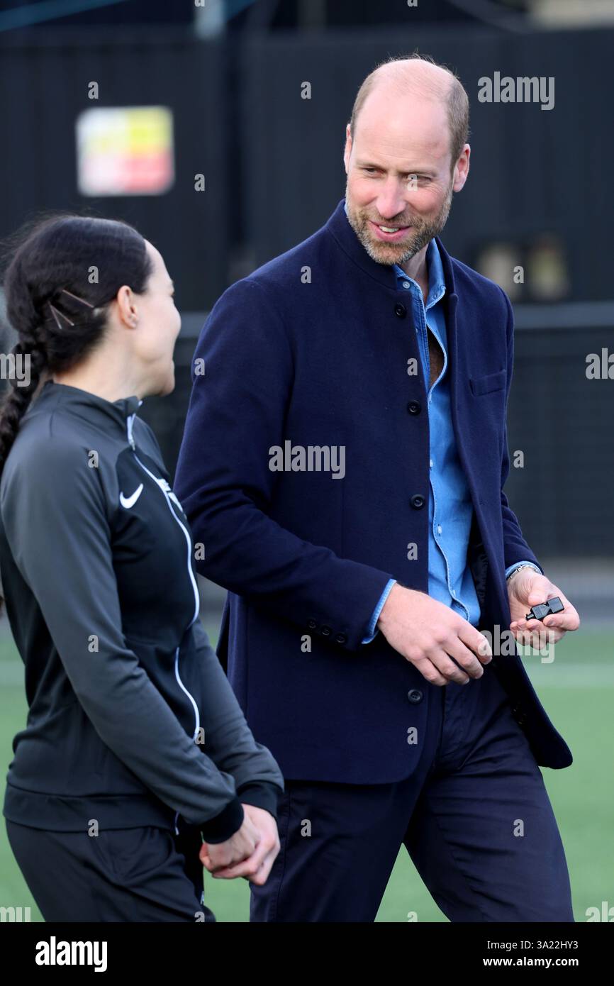 The Prince of Wales referees a mini football game during a visit to a ...