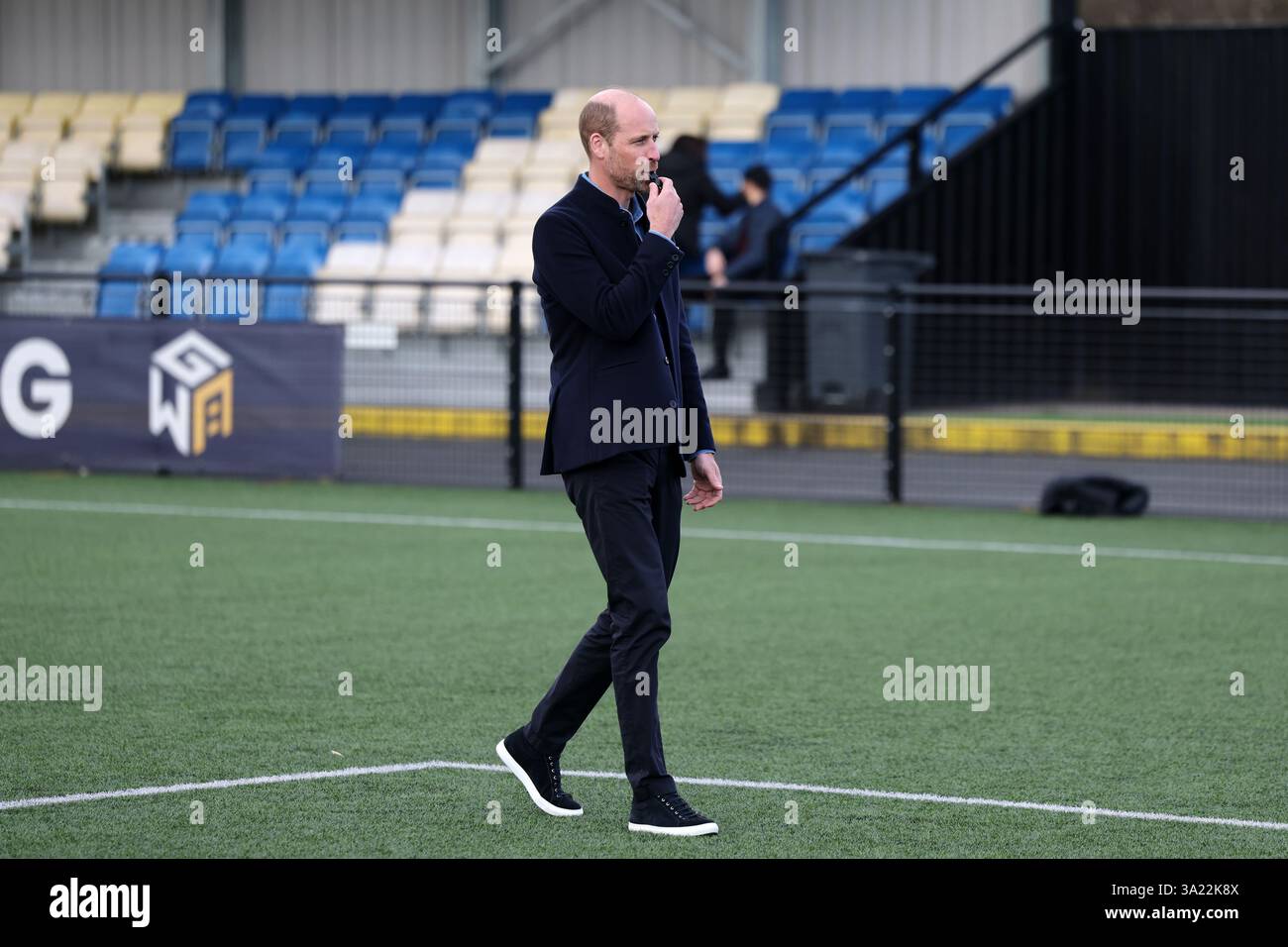 The Prince of Wales blows the referee's whistle during a mini football ...