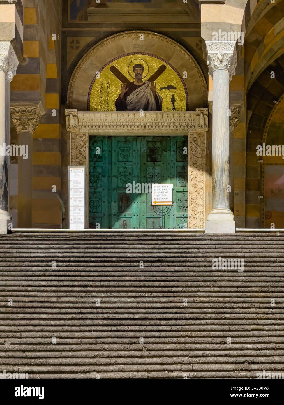 Amalfi, Salerno, Italy - July 6, 2024: Cathedral of St Andrew Apostle front facade. tympanum's mosaics portray The triumph of Christ created by Domeni Stock Photo