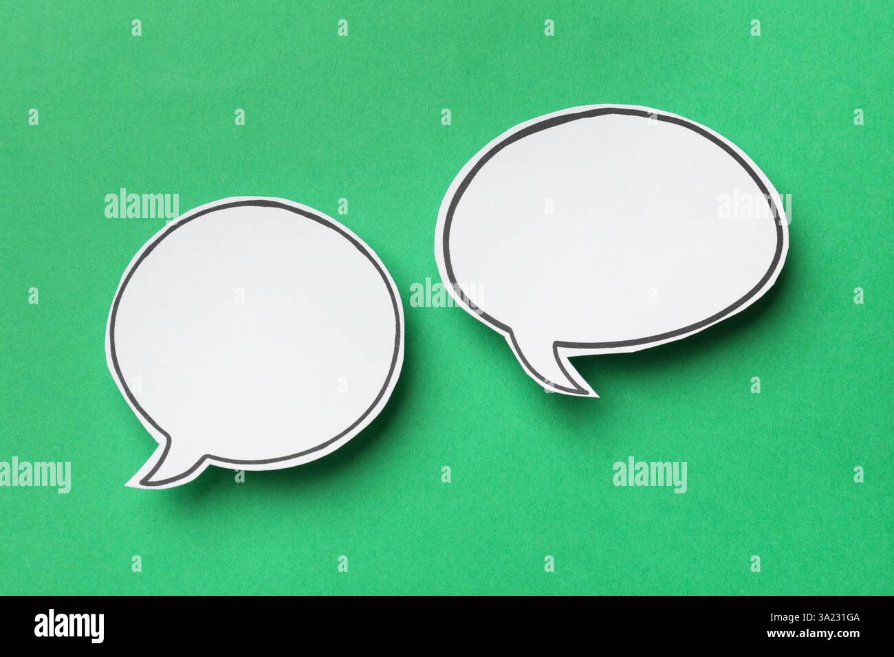 Blank speech bubbles on green background, top view. Space for text Stock Photo